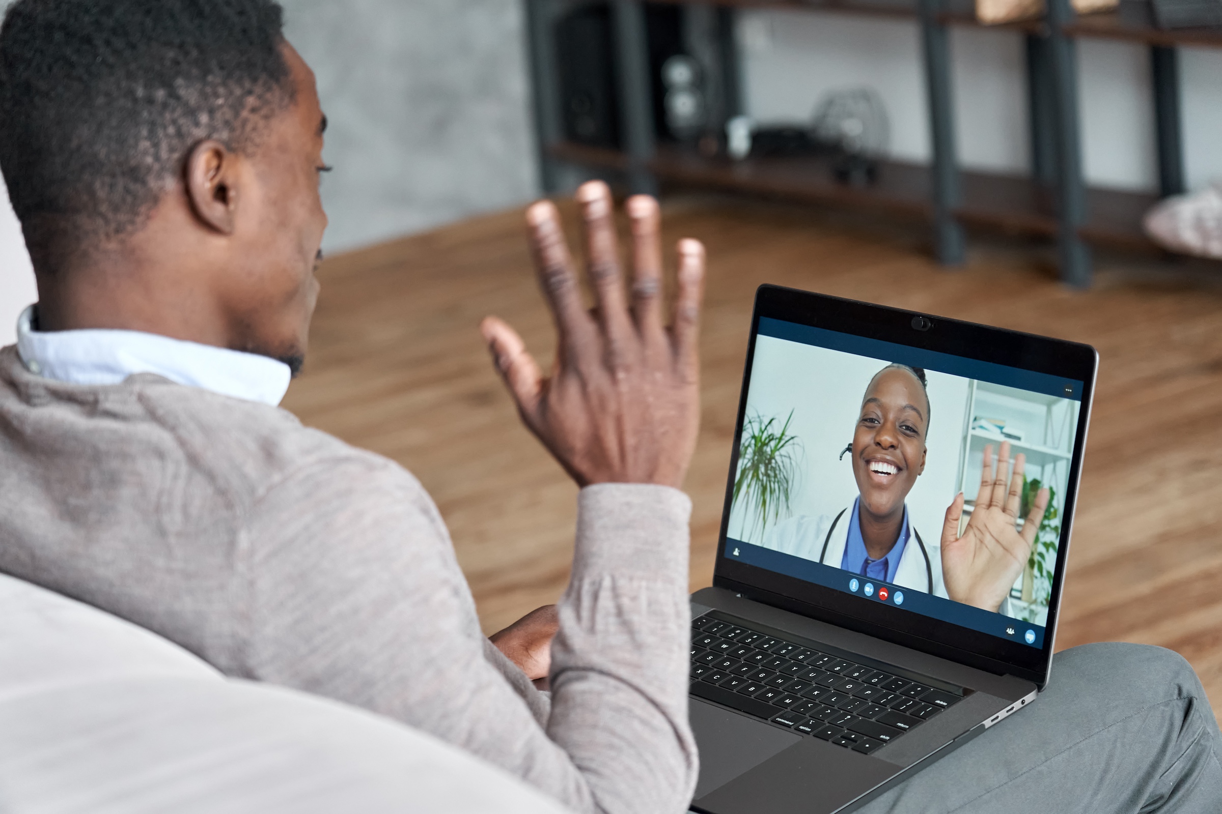 Person with back pain during a telehealth evaluation