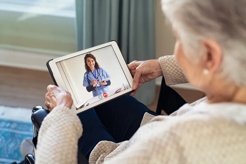 Woman discussing menopause and hormone therapy in a telehealth visit