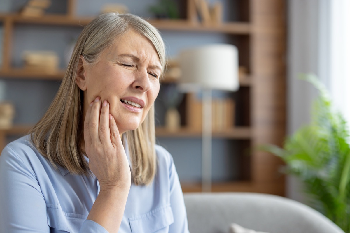 Person with tooth pain during a dental pain telehealth visit