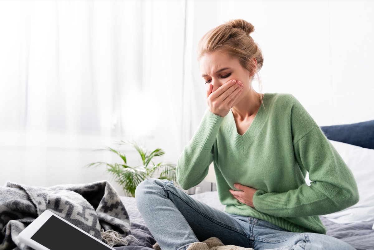 Person with stomach discomfort during a nausea telehealth visit