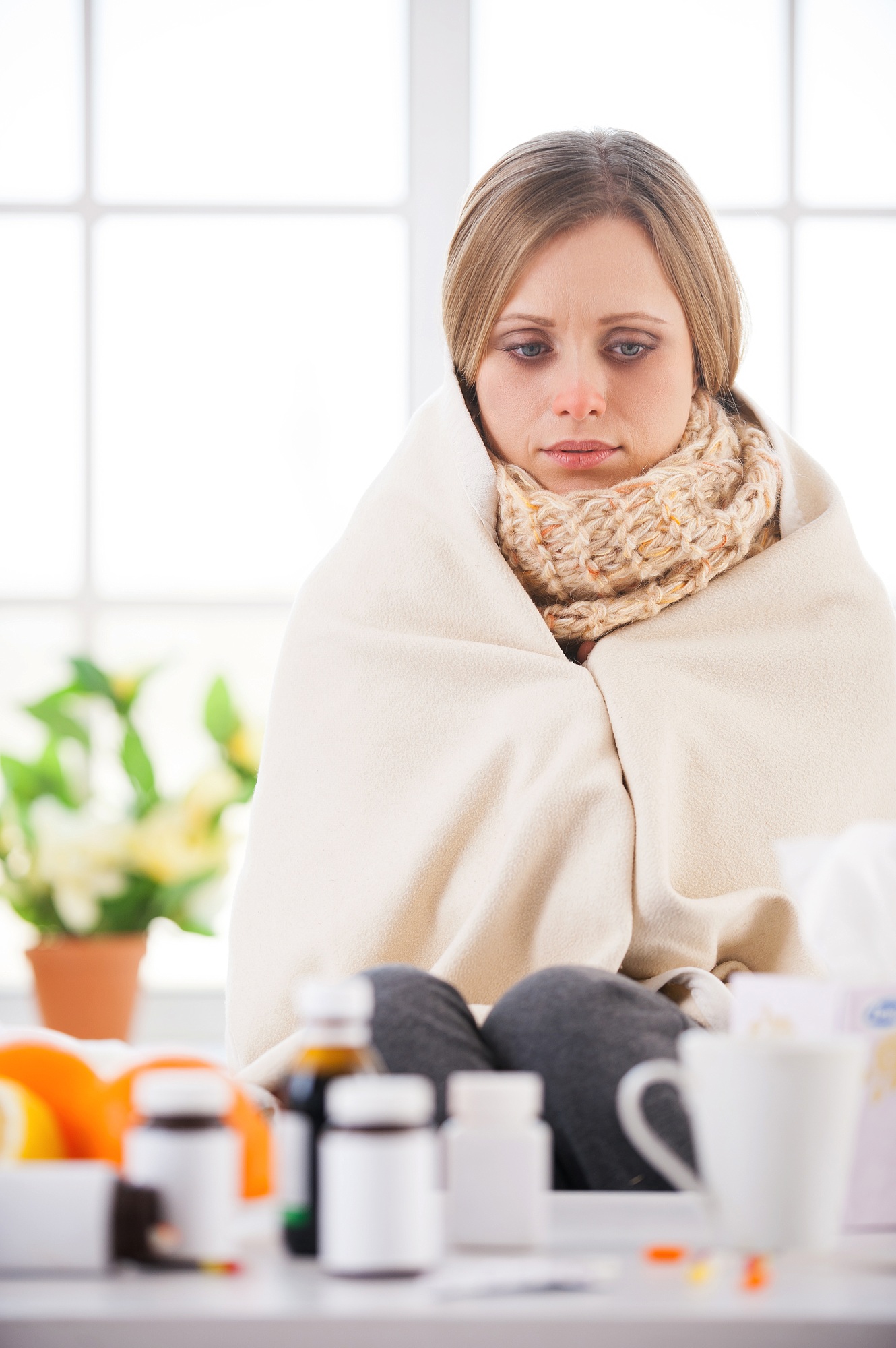 Person managing COVID-19 symptoms at home during a telehealth visit