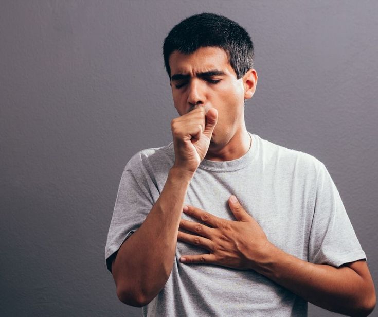 Person with a sore throat during a telehealth evaluation